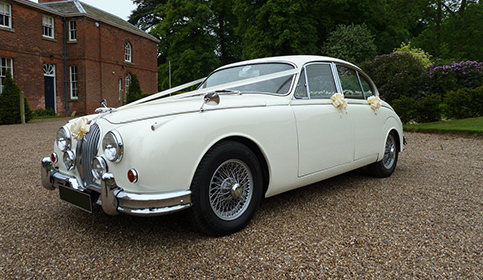 1961 MK II Jaguar in Old English White with spoked wheels